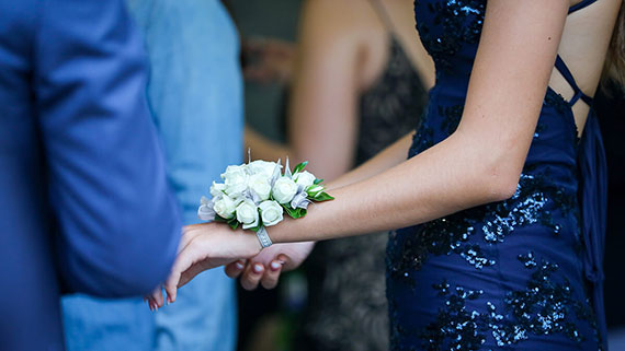 A girl in prom dress with car keys