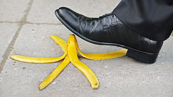 A man faceplanted at bottom of stairs