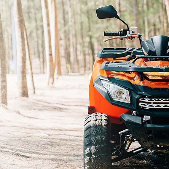 An ATV parked in a forest